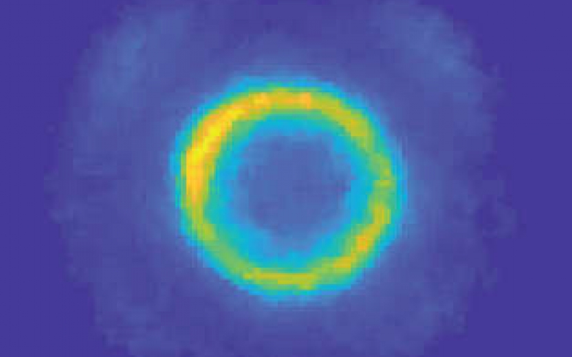 A mostly blue background with a yellow and green circle in the middle.