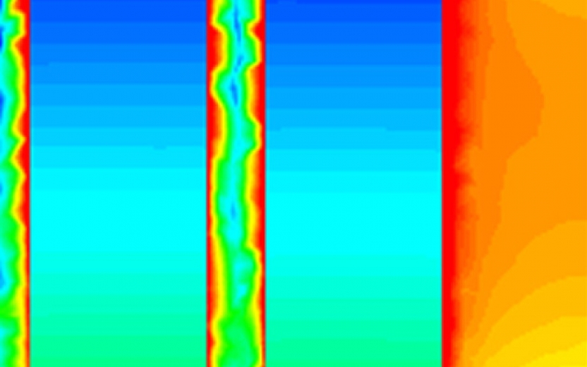 A cropped image of a Maxwell simulation of a solenoid. The image shows two vertical bands in a blue gradient surrounded by a warmer color gradient.